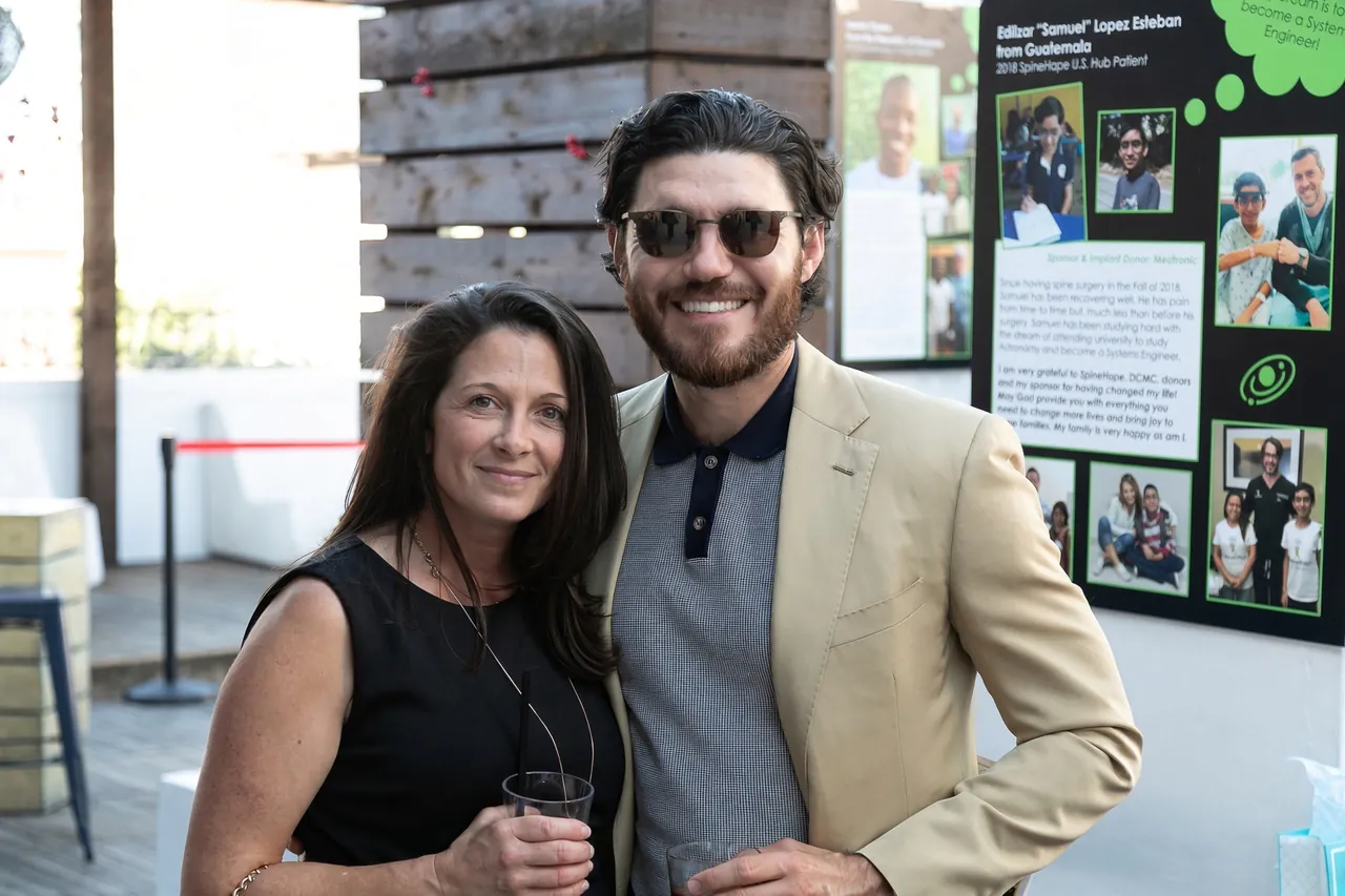 Two SpineHope supporters at a fundraising event