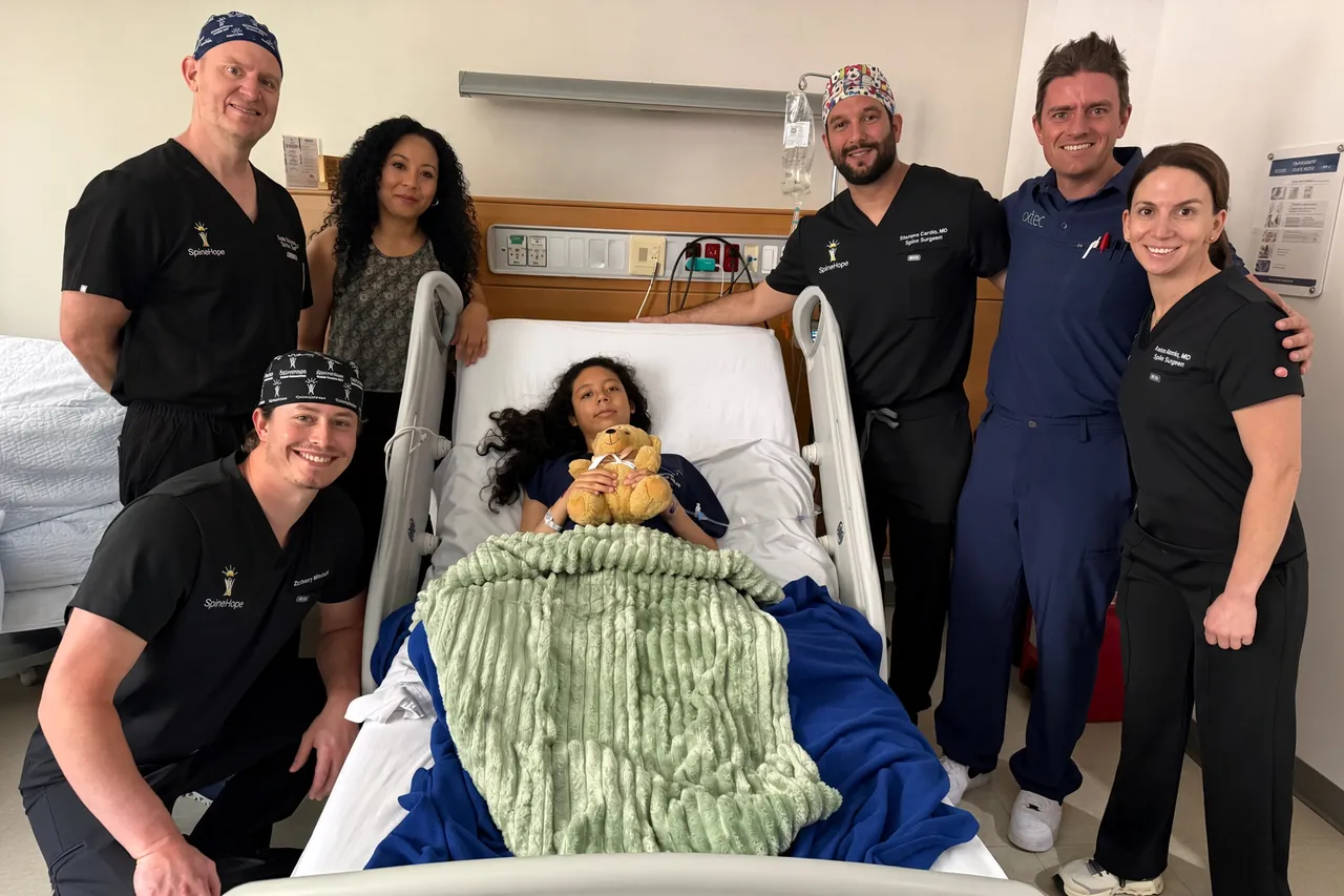 A SpineHope medical team with a patient after surgery