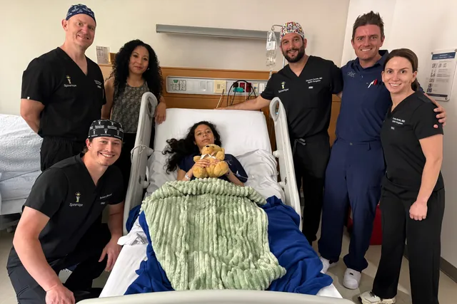 A SpineHope medical team with a patient after surgery