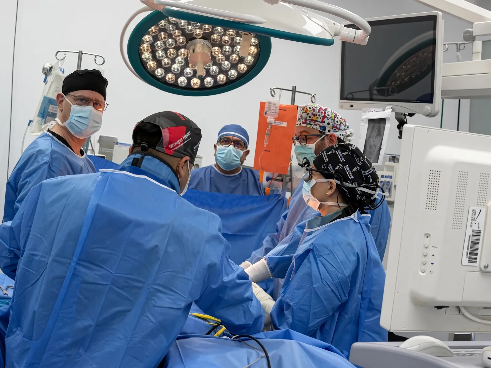 Surgical team in scrubs during a SpineHope Ecuador operating-room case