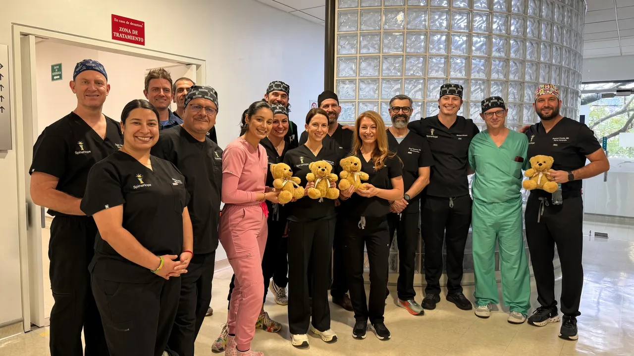 SpineHope surgical team with teddy bears for their patients in Quito