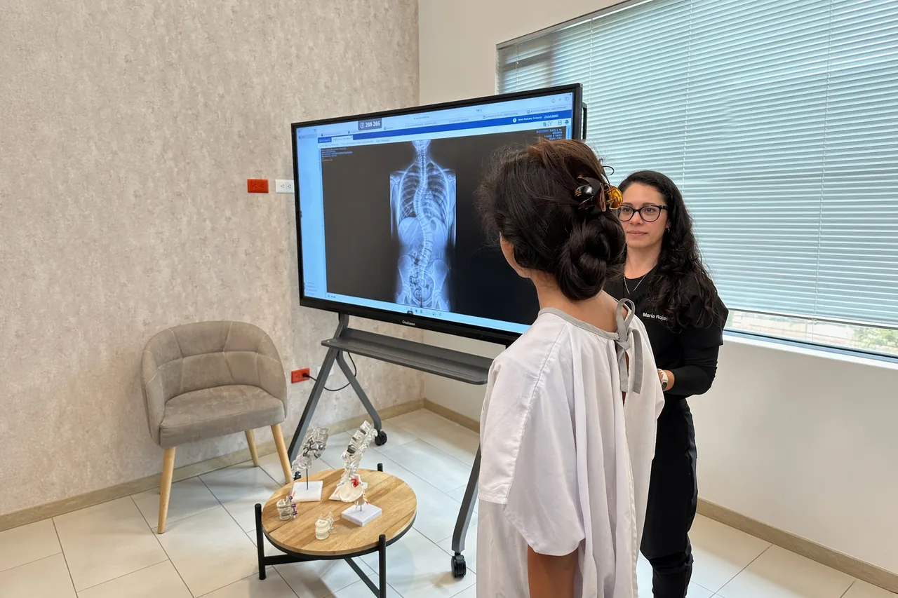 A SpineHope patient reviewing her spine X-ray