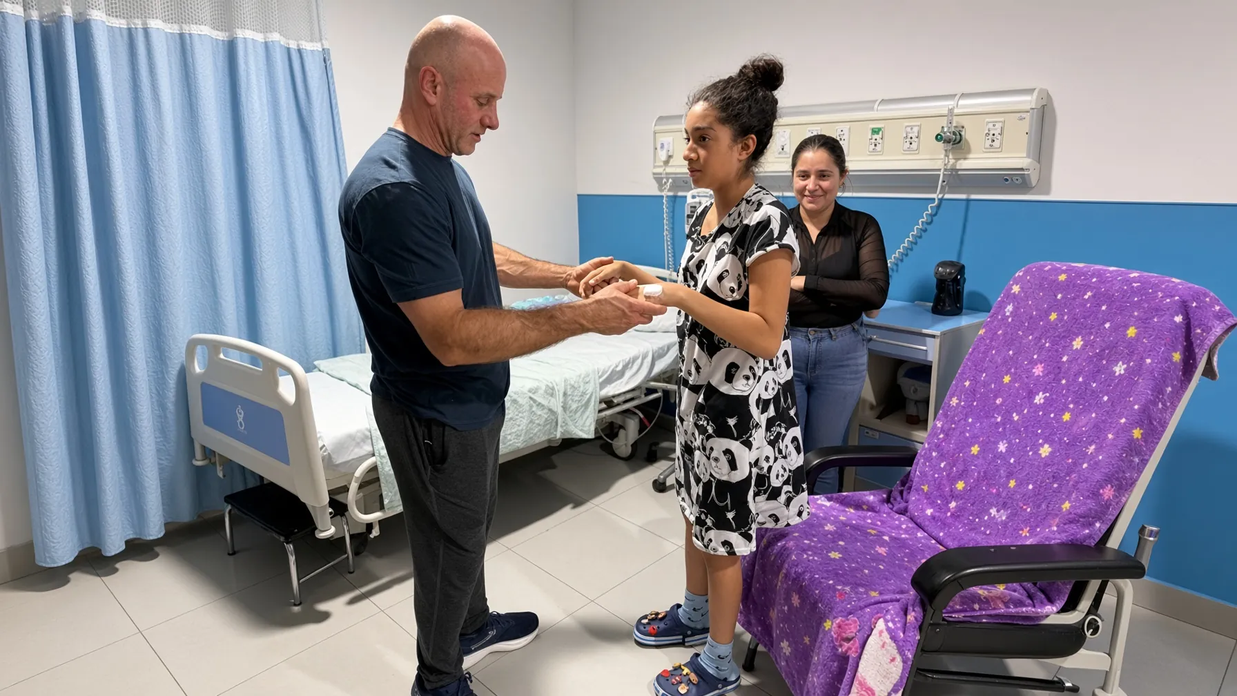SpineHope surgeon supporting a recent patient with parent in background