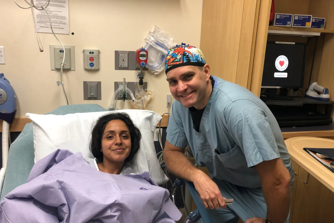 A SpineHope surgeon visiting a patient after surgery