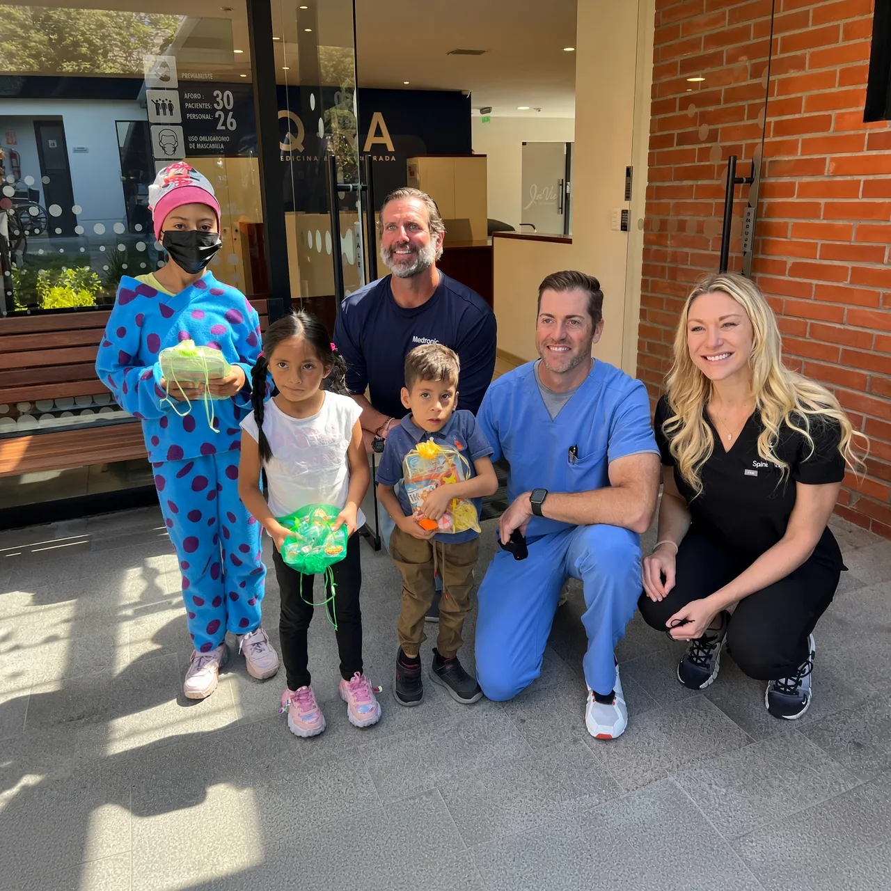 A SpineHope mission team with the children they treated