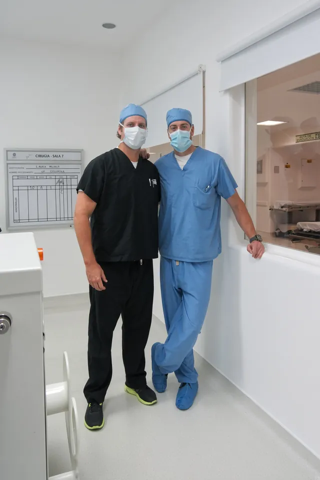 Two SpineHope volunteers in scrubs