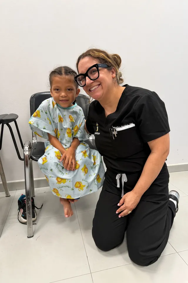 A SpineHope volunteer with a young patient