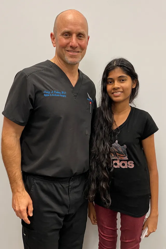 A SpineHope surgeon with a patient